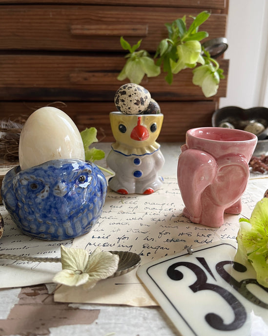 three novelty vintage egg cups
